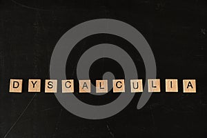 Dyscalculia math learning disorder concept - name of disorder on blackboard