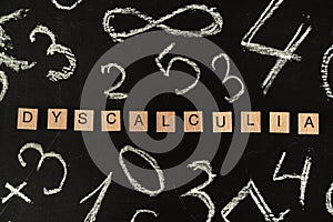 Dyscalculia math learning disorder concept - name of disorder on blackboard