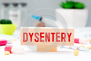 Dysentery, word cube with background, medical concept