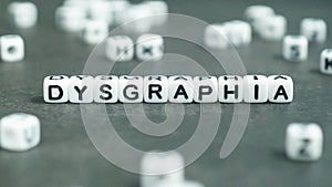 Dysgraphia word in white letter block beads. Front view. Dysgraphia concept.