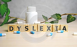 Dyslexia Word Written In Wooden Cube, medical concept