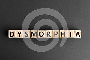 Dysmorphia - word from wooden blocks with letters