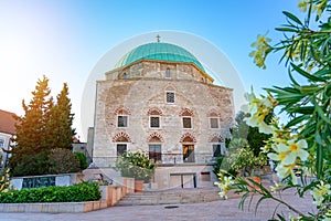 Dzsami mosque on the main square in Pecs Hungary with flowers