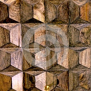 DÃÂ©tail of a brown natural wooden door with rÃÂ©gular geometric prisms wood.  Arts detail of material photo