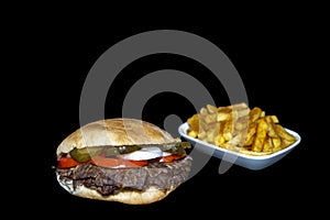 DÃ¶ner beef sandwich or SandviÃ§ dÃ¶ner with french fries IsolÃ¤ted on a black background