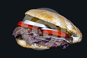 DÃ¶ner sandwich lamb or beef  meat called SandviÃ§ dÃ¶ner isolated on a Black background