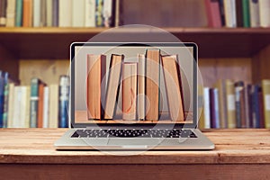 E-book library concept with laptop computer and books