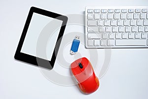 E-book reader with blank screen and keyboard and mouse and flash drives USB. on white background, Used modern gadgets or electroni