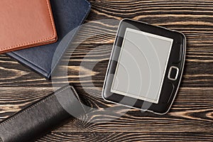 E-book reader close-up on wooden background
