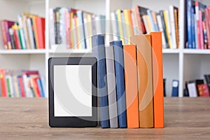 E-book reader and colorful bookshelf