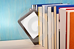 E-book reader between printed books