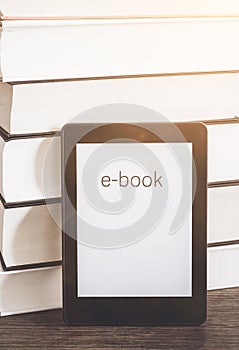 E-book reader on a stack of books