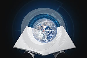 E-booking, Knowledge, education, and e-learning. Hand opened book and globe hologram. Elements of this image are furnished by NAS