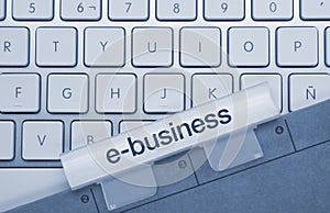 E-business - Inscription on Blue Keyboard Key photo