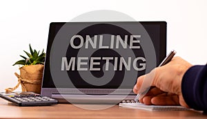 E-business online meeting concept. Tablet with text 'online meeting'. business and education during COVID-19