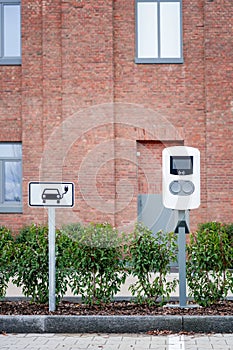 e-car charging station, e-car charge point, electric vehicle supply equipment information sign e-car public charging station