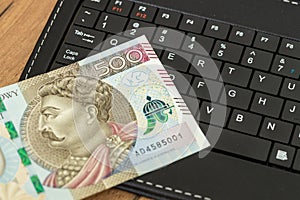 E-commerce business, Poland, money on tablet keyboard, 500 Polish zloty banknote, Shopping and online stores, concept, online