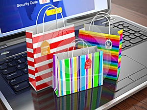 E-commerce concept. Colourful paper striped shopping bags