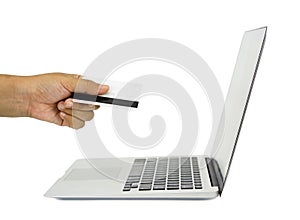 E-commerce concept image. a hand with credit card and notebook