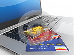 E-commerce. Credit cards on laptop