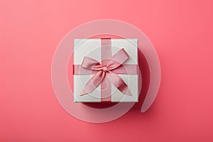 E commerce design features white square gift box on pink background