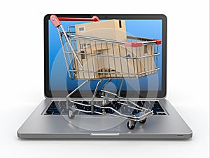 E-commerce. Shopping cart on laptop.