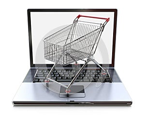 E-commerce. Shopping cart on laptop. Conceptual image