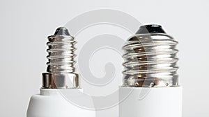 E14 and E27 light bulb screw fitting side by side photo