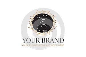 E Initial Letter Black and Gold Floral Hand Drawn Brand Logo