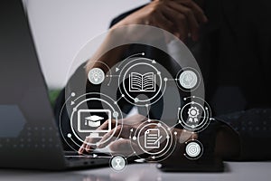 E-learning concept: person is using a laptop computer to learn