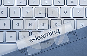E-learning - Inscription on Blue Keyboard Key photo