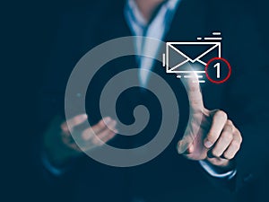 E-mail alert notification. Businessman hands hold smartphone and touch email icon and send e-mail or newsletter. Electronic mail