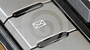 E-mail button, dedicated email client shortcut key with an envelope icon symbol on an office keyboard, sending e mails, messages