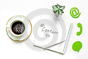 E-mail contact us concept with internet icons and coffee work desk background top view
