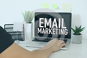 E-mail marketing business concept with businessman in office