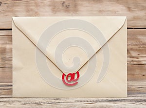 E-mail symbol and blank brown envelope