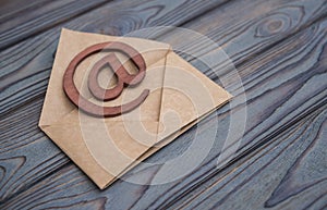 An e-mail symbol on a vintage mail envelope.