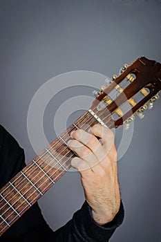 E Major Chord played by Guitarist on classical acoustic guitar