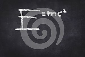 E=mc2 formula on chalkboard