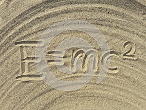 E mc2 write on the sand