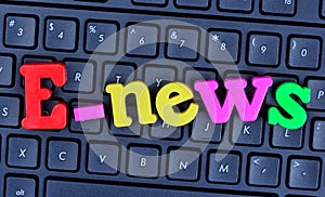 E-news word on computer keyboard