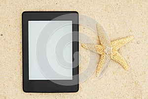 An e-reader on the beach for your summer reading