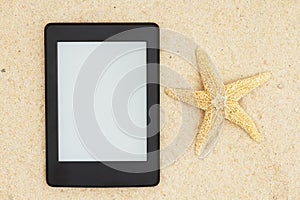 An e-reader on the beach for your summer reading