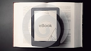 E reader. Digital e book, library reader tablet with books on dark background. Online education course, E learning class