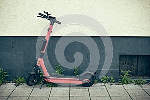 e-scooter on a house wall in a city