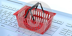 E shopping. Red shopping basket on a white computer keyboard, banner. 3d illustration