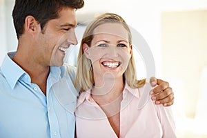 Each day she becomes more beautiful. a handsome man looking lovingly at his wife.