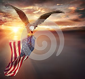 Eagle With American Flag Flies In Freedom At Sunset