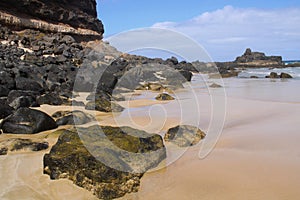 Eagle Beach. Rocky coast and golden sands. Spain