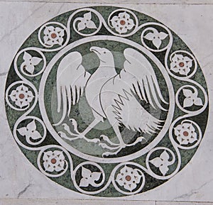 Eagle in a decorative circle on the Chiesa dei Santi Giovanni e Reparata